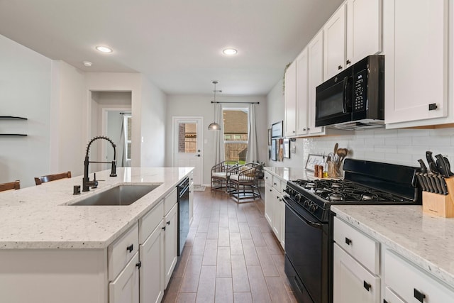 13110 Mid Stocket Dr, Humble, TX 77346 - kitchen featuring black appliances, a sink, recessed lighting, decorative backsplash, and white cabinetry