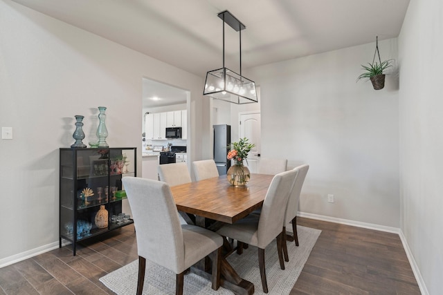 13110 Mid Stocket Dr, Humble, TX 77346 - dining area with dark wood-type flooring, baseboards, and a chandelier