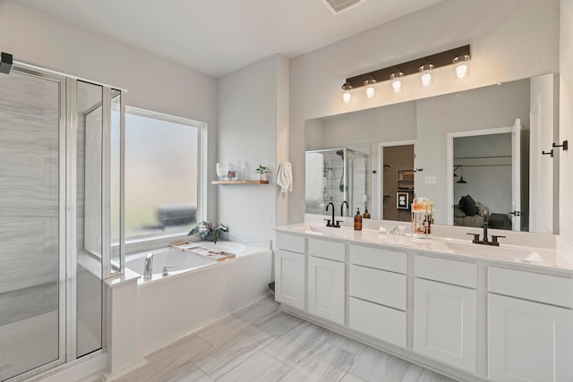 13110 Mid Stocket Dr, Humble, TX 77346 - ensuite bathroom featuring a stall shower, a bath, and double vanity