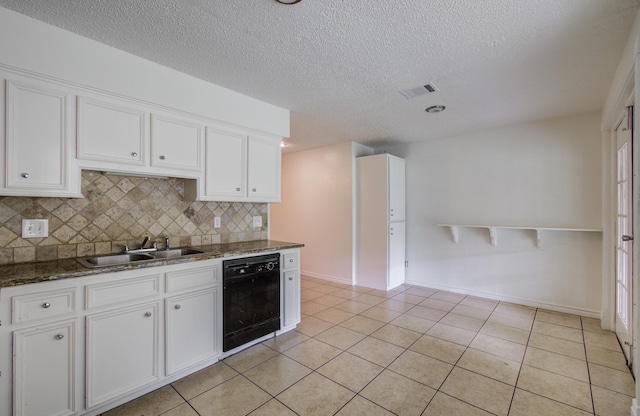 2614 Lemonwood Ln, Houston, TX 77038 - kitchen featuring dishwasher, a sink, white cabinets, backsplash, and a textured ceiling