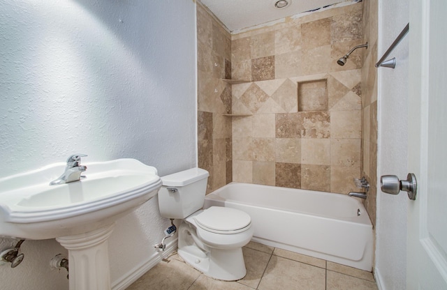 2614 Lemonwood Ln, Houston, TX 77038 - full bathroom with toilet, tile patterned floors, shower / bath combination, baseboards, and a textured wall