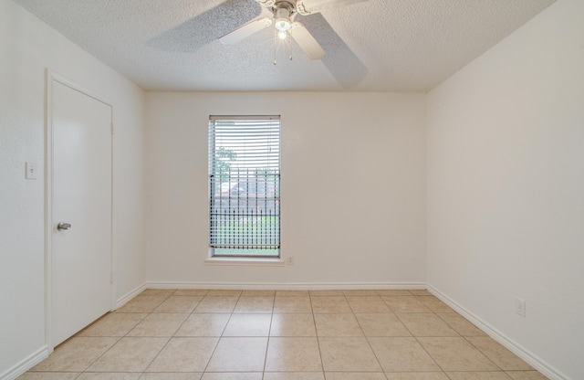 2614 Lemonwood Ln, Houston, TX 77038 - spare room featuring a textured ceiling, a ceiling fan, and light tile patterned floors