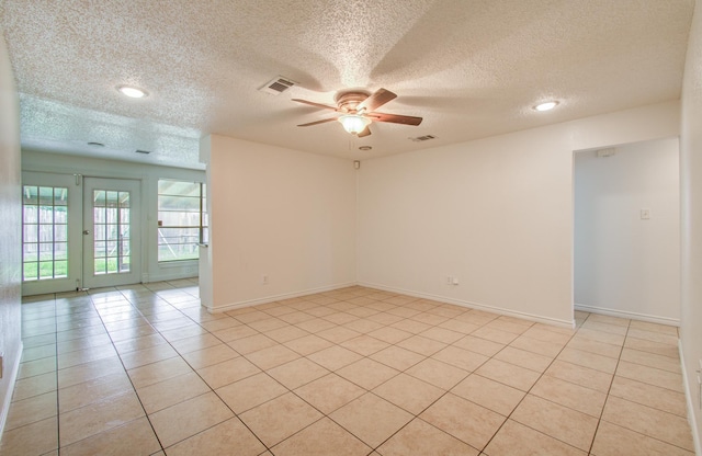 2614 Lemonwood Ln, Houston, TX 77038 - empty room featuring ceiling fan, a textured ceiling, light tile patterned floors, recessed lighting, and baseboards