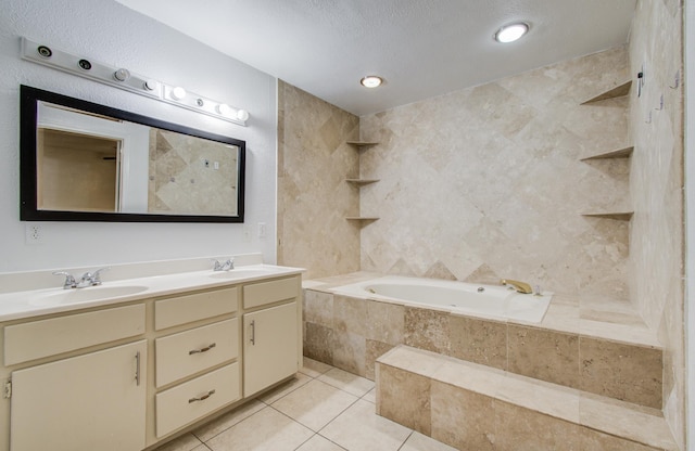 2614 Lemonwood Ln, Houston, TX 77038 - bathroom featuring double vanity, tiled tub, and tile patterned flooring