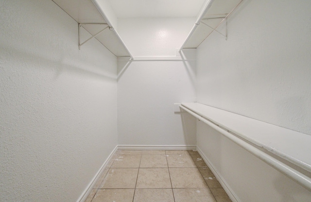 2614 Lemonwood Ln, Houston, TX 77038 - spacious closet featuring light tile patterned flooring