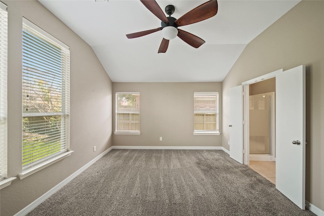 1928 Cypress Ln, Dayton, TX 77535 - unfurnished bedroom featuring vaulted ceiling, carpet, multiple windows, and baseboards