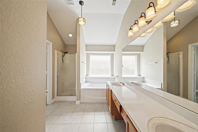 1928 Cypress Ln, Dayton, TX 77535 - bathroom with vaulted ceiling, a shower stall, a bath, tile patterned flooring, and double vanity