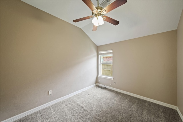1928 Cypress Ln, Dayton, TX 77535 - spare room featuring ceiling fan, vaulted ceiling, carpet flooring, and baseboards