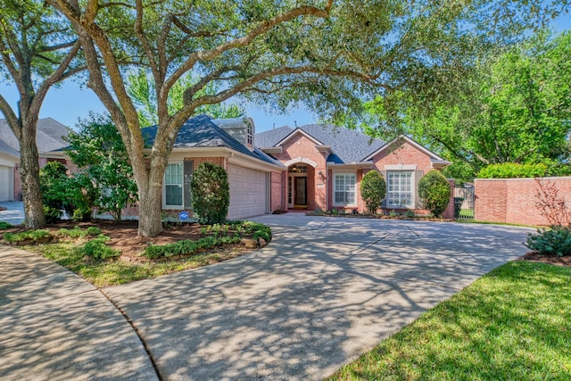1114 Ridgeburg Ct, Houston, TX 77077 - view of front facade with brick siding, a garage, concrete driveway, a gate, and roof with shingles