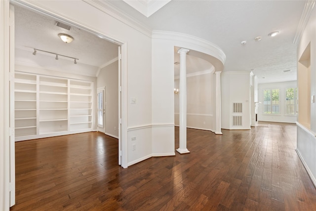 1114 Ridgeburg Ct, Houston, TX 77077 - entrance foyer with ornate columns, ornamental molding, wood-type flooring, baseboards, and a textured ceiling