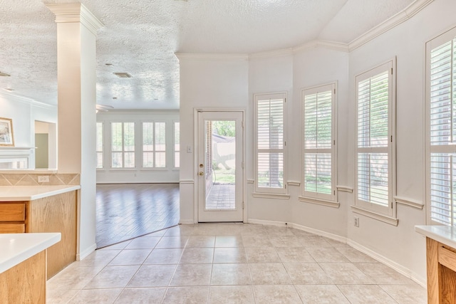 1114 Ridgeburg Ct, Houston, TX 77077 - doorway to outside with light tile patterned flooring, ornamental molding, a textured ceiling, and baseboards