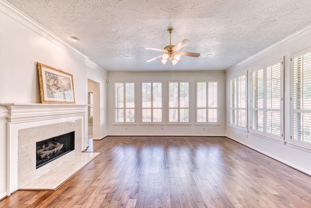 1114 Ridgeburg Ct, Houston, TX 77077 - unfurnished living room featuring a ceiling fan, a textured ceiling, wood finished floors, a fireplace, and ornamental molding