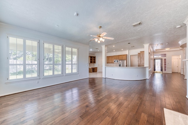 1114 Ridgeburg Ct, Houston, TX 77077 - unfurnished living room with healthy amount of natural light, ceiling fan, crown molding, dark wood finished floors, and a textured ceiling