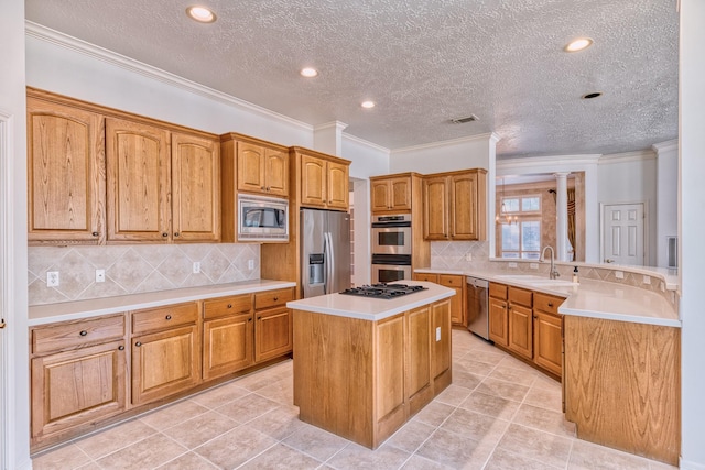 1114 Ridgeburg Ct, Houston, TX 77077 - kitchen featuring stainless steel appliances, a sink, a center island, light countertops, and tasteful backsplash