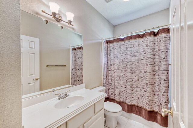 1114 Ridgeburg Ct, Houston, TX 77077 - bathroom with toilet, tile patterned floors, shower / tub combo, and vanity