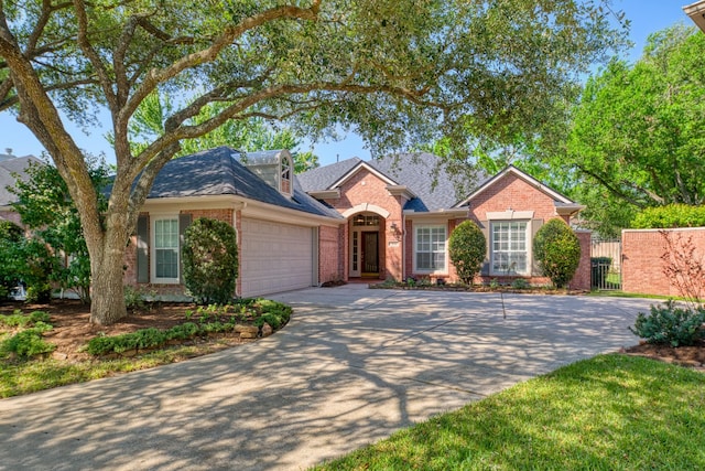 1114 Ridgeburg Ct, Houston, TX 77077 - view of front of house featuring brick siding, an attached garage, driveway, a gate, and fence