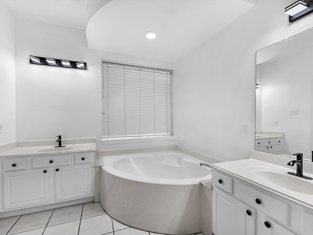 126 Oryan Ct, Houston, TX 77015 - full bath with two vanities, tile patterned flooring, a garden tub, and recessed lighting