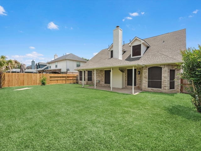 126 Oryan Ct, Houston, TX 77015 - back of property featuring a patio, a chimney, a shingled roof, and brick siding