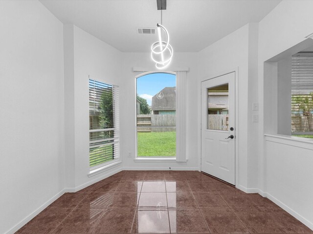 126 Oryan Ct, Houston, TX 77015 - unfurnished dining area with dark tile patterned flooring
