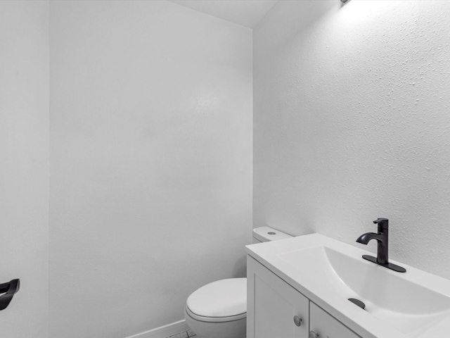 126 Oryan Ct, Houston, TX 77015 - half bathroom featuring toilet, vanity, and baseboards
