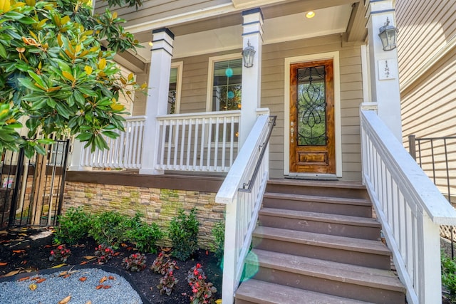 1184 Nelson Falls Ln, Houston, TX 77008 - doorway to property featuring covered porch and stone siding