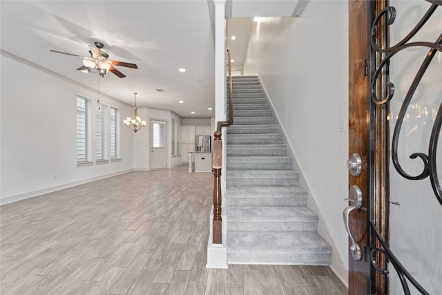 1184 Nelson Falls Ln, Houston, TX 77008 - staircase with ceiling fan, wood finished floors, recessed lighting, baseboards, and a chandelier