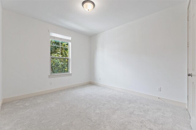 1184 Nelson Falls Ln, Houston, TX 77008 - spare room featuring carpet flooring and baseboards