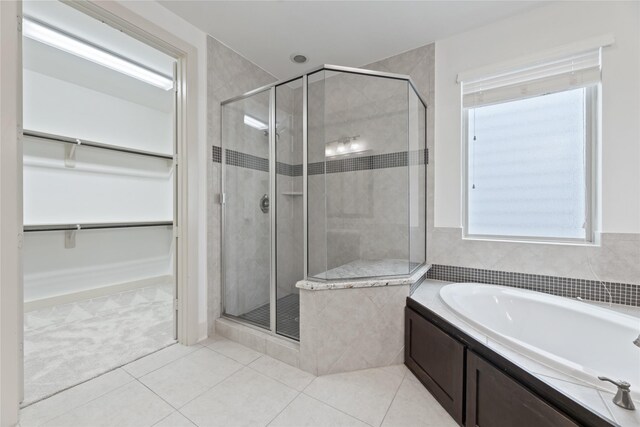 1184 Nelson Falls Ln, Houston, TX 77008 - full bath featuring a garden tub, a stall shower, a walk in closet, and tile patterned floors