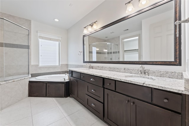 1184 Nelson Falls Ln, Houston, TX 77008 - full bathroom with a shower stall, double vanity, a garden tub, and tile patterned floors