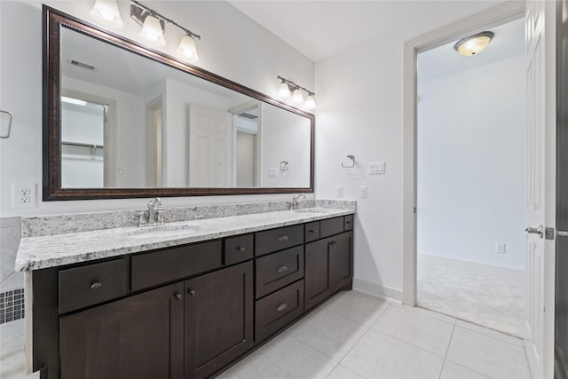 1184 Nelson Falls Ln, Houston, TX 77008 - bathroom featuring double vanity, tile patterned flooring, and baseboards