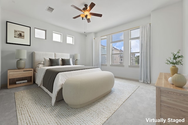 1184 Nelson Falls Ln, Houston, TX 77008 - carpeted bedroom with ceiling fan and baseboards