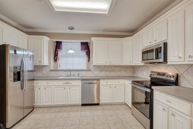 9822 El Chaco St, Baytown, TX 77521 - kitchen with stainless steel appliances, a sink, crown molding, tasteful backsplash, and light countertops