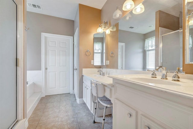 9822 El Chaco St, Baytown, TX 77521 - full bath featuring tile patterned flooring, a stall shower, a garden tub, and double vanity