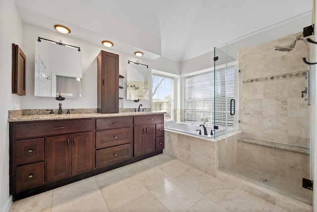 14902 Autumnvale Ln, Cypress, TX 77429 - full bathroom featuring a bath, a shower stall, double vanity, tile patterned floors, and vaulted ceiling