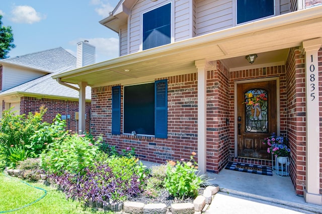 10835 Spruce Dr S, La Porte, TX 77571 - entrance to property with brick siding, covered porch, and a chimney