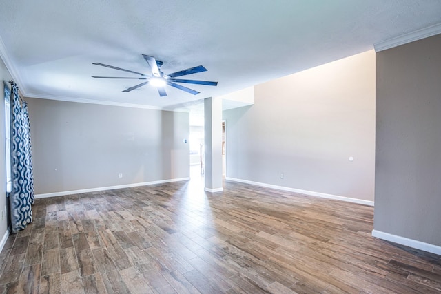 10835 Spruce Dr S, La Porte, TX 77571 - spare room with ceiling fan, wood finished floors, crown molding, and baseboards