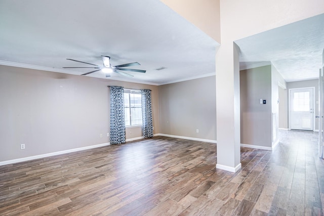 10835 Spruce Dr S, La Porte, TX 77571 - spare room with ornamental molding, a ceiling fan, wood finished floors, healthy amount of natural light, and baseboards