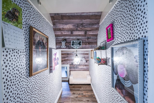 10835 Spruce Dr S, La Porte, TX 77571 - bedroom featuring wood finished floors, wooden walls, and wallpapered walls