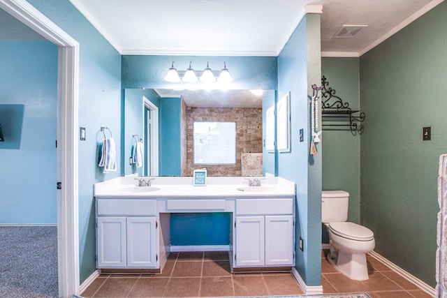 10835 Spruce Dr S, La Porte, TX 77571 - full bathroom featuring toilet, ornamental molding, tile patterned floors, and double vanity