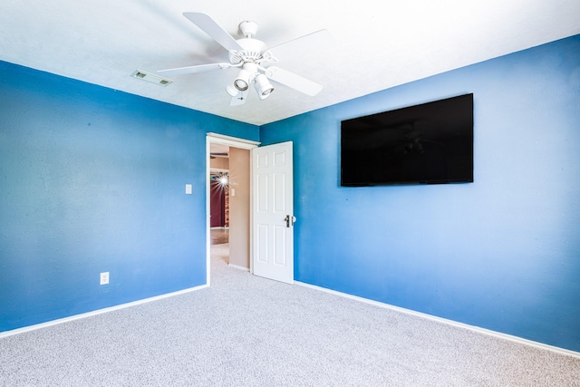 10835 Spruce Dr S, La Porte, TX 77571 - unfurnished bedroom with carpet floors, baseboards, and ceiling fan