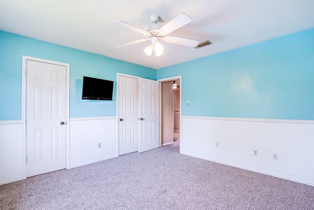 10835 Spruce Dr S, La Porte, TX 77571 - unfurnished bedroom featuring carpet flooring and ceiling fan