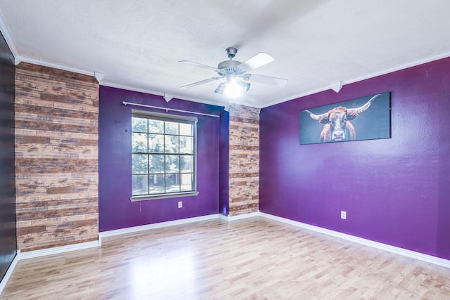10835 Spruce Dr S, La Porte, TX 77571 - empty room with ornamental molding, ceiling fan, wood finished floors, and baseboards
