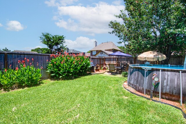 10835 Spruce Dr S, La Porte, TX 77571 - view of yard featuring a patio