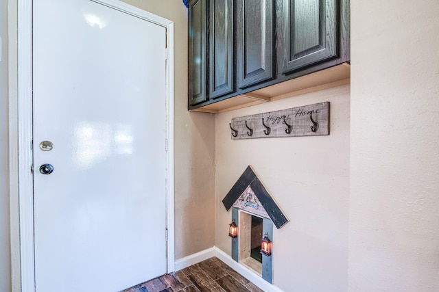 10835 Spruce Dr S, La Porte, TX 77571 - mudroom featuring dark wood-style floors and baseboards