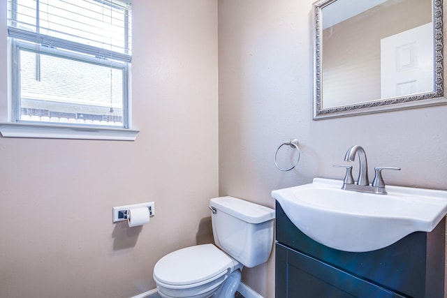 10835 Spruce Dr S, La Porte, TX 77571 - half bath featuring toilet, baseboards, and vanity