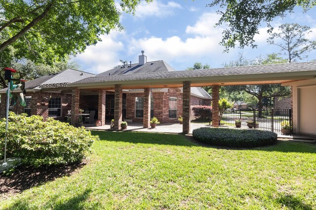 12127 Via San Rocco Ct, Cypress, TX 77429 - rear view of property with a patio, a chimney, and brick siding
