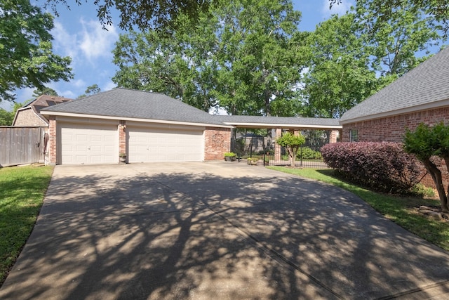 12127 Via San Rocco Ct, Cypress, TX 77429 - view of front of house featuring brick siding, concrete driveway, and fence