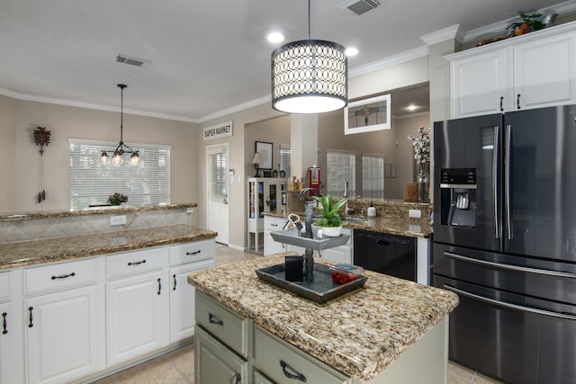 12127 Via San Rocco Ct, Cypress, TX 77429 - kitchen featuring black appliances, crown molding, a kitchen island, white cabinets, and light stone counters