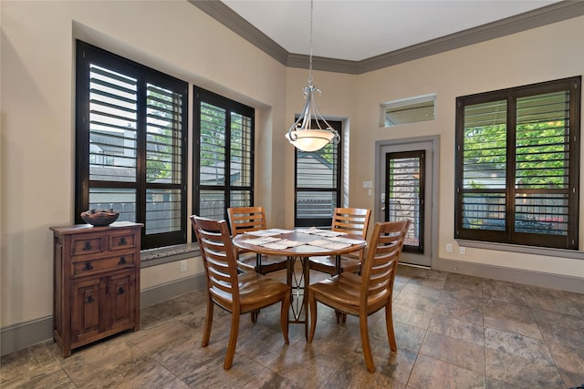 9010 Kapri Ln, Houston, TX 77025 - dining space featuring ornamental molding, stone finish flooring, and baseboards