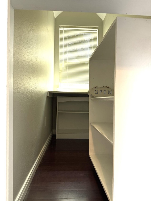 2810 Bright Trl, Sugar Land, TX 77479 - hallway with dark wood-type flooring and baseboards